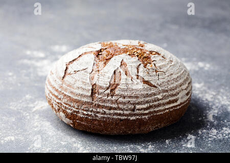 Bread rye, whole grain on a grey background. Copy space. Stock Photo