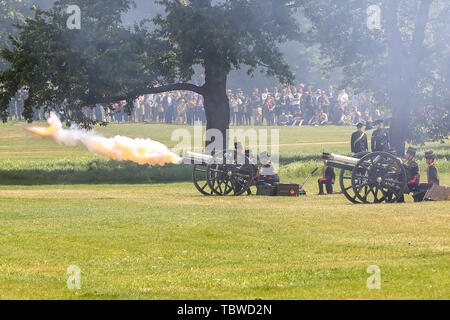 Members of the King’s Troop Royal Horse Artillery take part in a 82 gun salutes at Green Park in  London.   41 gun salutes are fired in the honour of the 3 days State Visit of the President and First Lady of the United States of America to the UK followed by further 41 gun salutes commemorate the anniversary of the Coronation of Her Majesty the Queen. Stock Photo