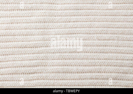 White, beige knitted wool texture background pattern with high resolution. Top view. Copy space. Stock Photo