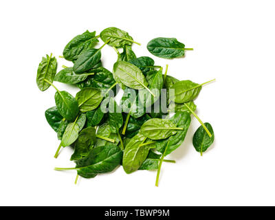 Heap of baby spinach leaves. Fresh green baby spinach isolated on white with clipping path. Top view or flat lay Stock Photo