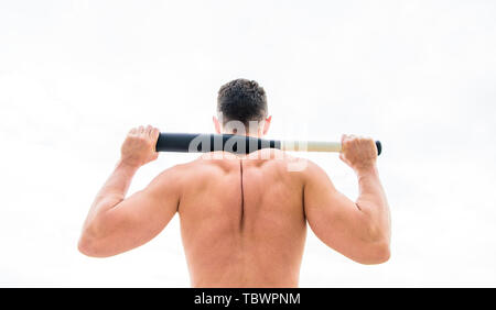 Attack and defence. Get ready attack. Man with baseball bat. Hooligan hits bat. Victory requires payment in advance. Bandit aggression anger. Muscular man fighting. Violence and attack. Street fight. Stock Photo