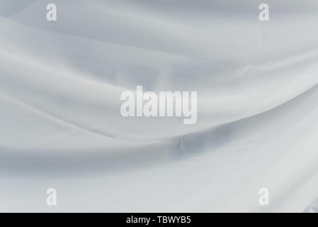 flying transparent fabric. white fabric with waves on it. curtain folds Stock Photo