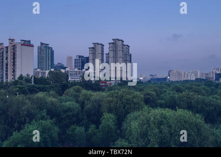 cityscape of Seoul at dusk with Yeouido Park underneath Stock Photo