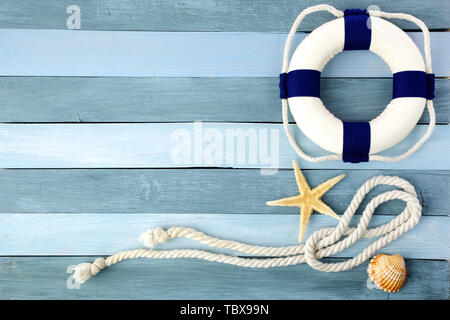 Few summer marine items on a blue wooden background. Stock Photo
