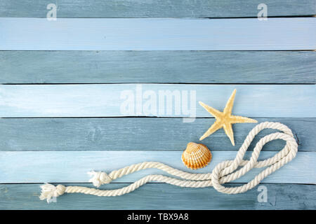 Few summer marine items on a blue wooden background. Stock Photo