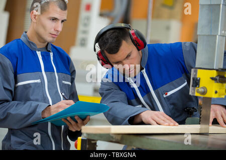 two engineers are working with wood Stock Photo