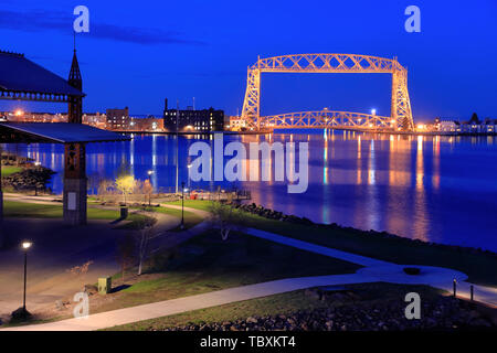 The night view of Aerial Lift Bridge with Bayfront Festival Park and Duluth harbor basin in foreground. Duluth.Minnesota.USA Stock Photo