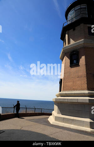 Split Rock Lighthouse in Silver Bay with a guide in traditional lighthouse keepers' uniform.Lake County.Lake Superior.Minnesota.USA Stock Photo