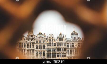 View of Grand Place in Brussels through a hole in the traditional Belgian waffle. Stock Photo