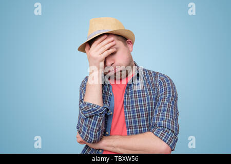 Feeling depressed and tired on vacation. Sun or heatstroke Stock Photo