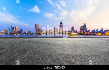 Shanghai bund city skyline and empty asphalt road ground at night Stock Photo