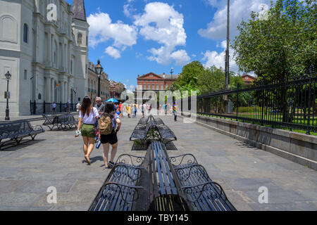 New Orleans, LA, USA -- May 23, 2019.  Wide angle horizontal shot of tourists walking in Jackson Square by St Louis Cathedral. Stock Photo