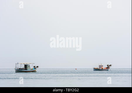Two small fishing boat at sea surface Stock Photo