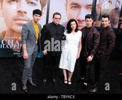 Los Angeles, California, USA 3rd June 2019 Singer Joe Jonas, father Paul Kevin Jonas Sr., mother Denise Miller Jonas, singer Nick Jonas and singer Kevin Jonas of The Jonas Brothers attend the World Premiere of Jonas Brothers Chasing Happiness on June 3, 2019 at Regency Bruin Theater in Los Angeles, California, USA. Photo by Barry King/Alamy Live News Stock Photo