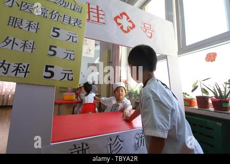 Handan, Handan, China. 4th June, 2019. Handan, CHINA-Kids experience different vocations including nurse and chef at a kindergarten in Handan, north ChinaÃ¢â‚¬â„¢s Xinjiang, marking ChildrenÃ¢â‚¬â„¢s Day. Credit: SIPA Asia/ZUMA Wire/Alamy Live News Stock Photo