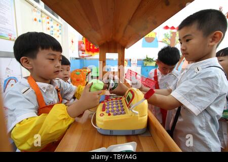 Handan, Handan, China. 4th June, 2019. Handan, CHINA-Kids experience different vocations including nurse and chef at a kindergarten in Handan, north ChinaÃ¢â‚¬â„¢s Xinjiang, marking ChildrenÃ¢â‚¬â„¢s Day. Credit: SIPA Asia/ZUMA Wire/Alamy Live News Stock Photo