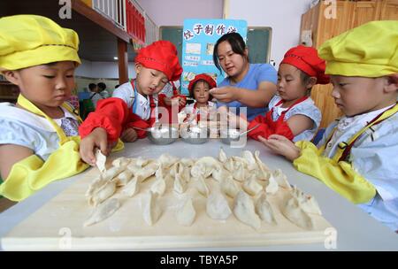 Handan, Handan, China. 4th June, 2019. Handan, CHINA-Kids experience different vocations including nurse and chef at a kindergarten in Handan, north ChinaÃ¢â‚¬â„¢s Xinjiang, marking ChildrenÃ¢â‚¬â„¢s Day. Credit: SIPA Asia/ZUMA Wire/Alamy Live News Stock Photo