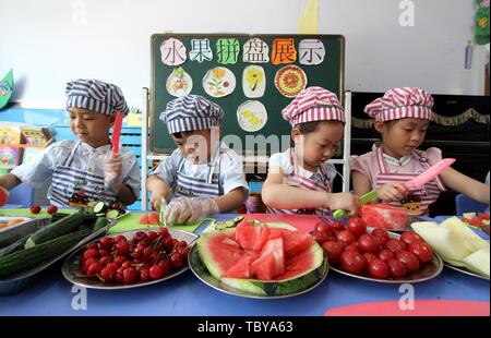 Handan, Handan, China. 4th June, 2019. Handan, CHINA-Kids experience different vocations including nurse and chef at a kindergarten in Handan, north ChinaÃ¢â‚¬â„¢s Xinjiang, marking ChildrenÃ¢â‚¬â„¢s Day. Credit: SIPA Asia/ZUMA Wire/Alamy Live News Stock Photo