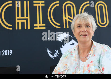 Magdeburg, Germany. 04th June, 2019. Karen Stone, General Director of the Theater Magdeburg, sits during the press conference of the Domplatz-Open-Air 'Chicago' in front of a poster for the event. The open-air musical 'Chicago' will take place from 14 June to 07 July 2017. Credit: Peter Gercke/dpa-Zentralbild/ZB/dpa/Alamy Live News Stock Photo