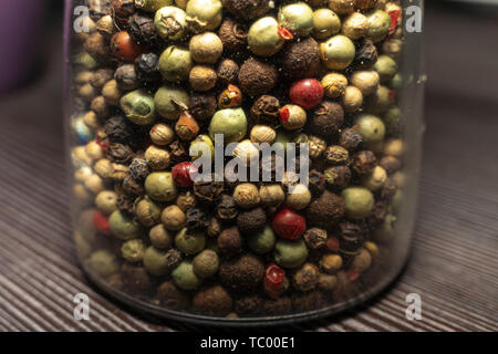 Various mixed peppercorns in a glass (Close-UP) Stock Photo
