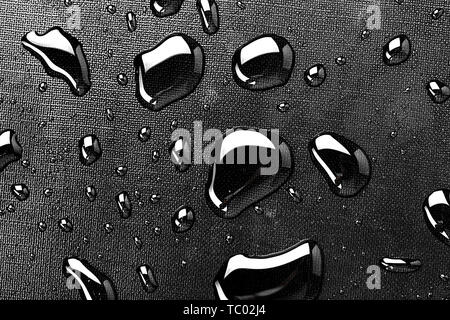 water drops splash on the black floor Stock Photo