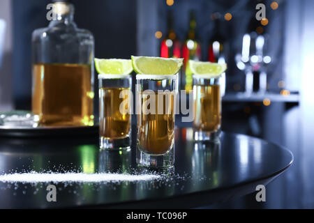 Shots of tequila on table in bar Stock Photo