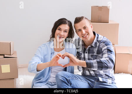 Adorable loving couple after moving into new house Stock Photo - Alamy