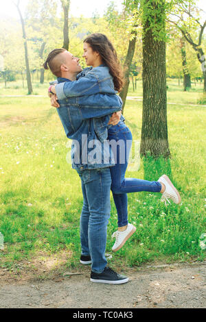 Happy loving couple resting in park Stock Photo