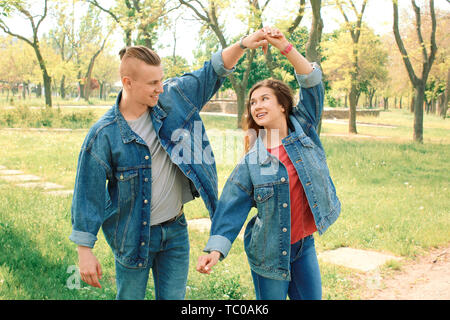 Happy loving couple dancing in park Stock Photo