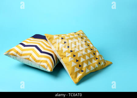 Soft pillows on color background Stock Photo