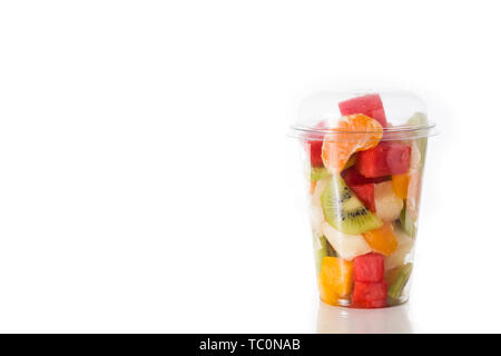 Fresh cut fruit in a plastic cup isolated on white background Stock Photo