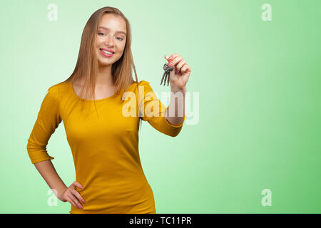 Young beautiful woman holding a bunch of keys Stock Photo