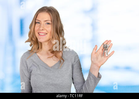 Young beautiful woman holding a bunch of keys Stock Photo