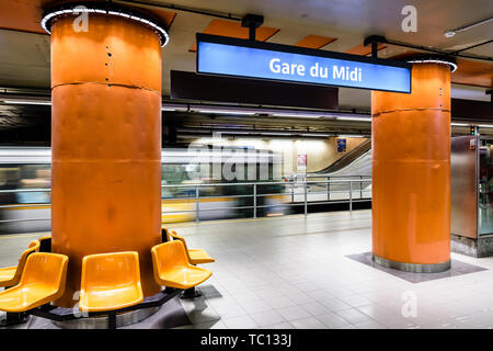 A streetcar arriving at the empty platform in the Gare du Midi/Zuidstation subway station, located under the Brussels-South railway station in Belgium Stock Photo