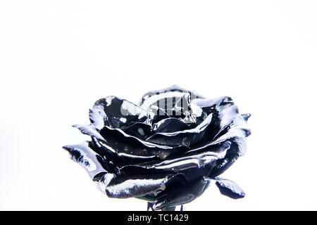 Forging and sculpture. Beautiful black silver flower. Floral shop. Metallic steel color. Flower covered metallic paint close up. Metal flower. Abstract art. Eternal beauty. Botany concept. Stock Photo