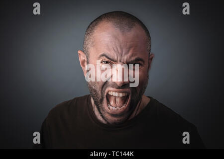 Portrait of angry man screaming. Concept of anger and stress. Stock Photo