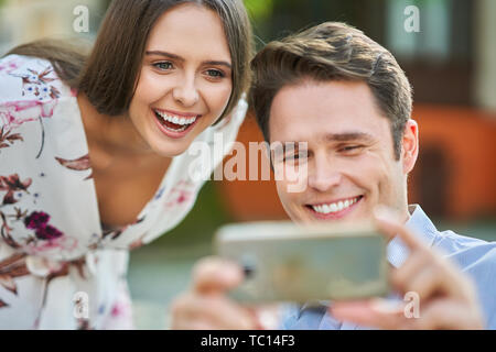 Picture of young couple dating in the park in summer Stock Photo