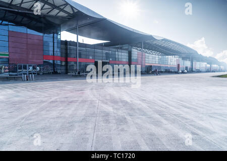 empty concrete floor and modern building with abstract top Stock Photo