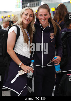England's Toni Duggan (left) and Abbie McManus at Heathrow Airport in London, as the England Women's team depart for the Women's World Cup in France. Stock Photo