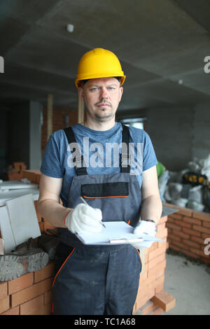 Serious worker in hardhat Stock Photo