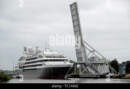 The ship Le Boreal sails along the Caen Canal through the Pegasus Bridge in Normandy, France, ahead of the 7th anniversary of D-Day. Stock Photo