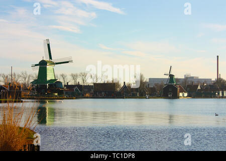 the famous Zaanse Scans mills in Zaandam, on the Zaan river. famous holland attraction, windmills. Stock Photo