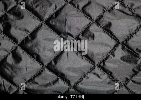 Dark patterned textile surface texture Stock Photo