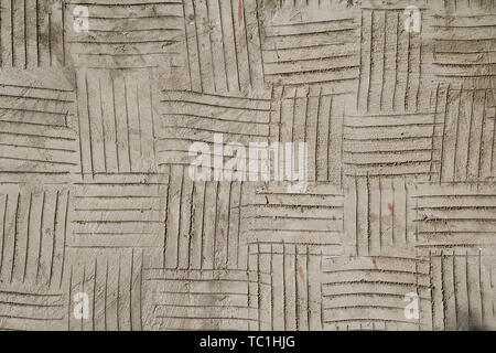 Grunge cracked gray plaster surface texture Stock Photo