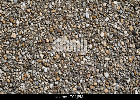Aged pebble wall surface texture Stock Photo