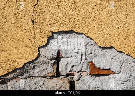 Yellow cracked weathered wall surface texture Stock Photo