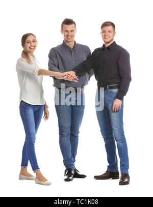 Group of young business people putting hands together on white background Stock Photo