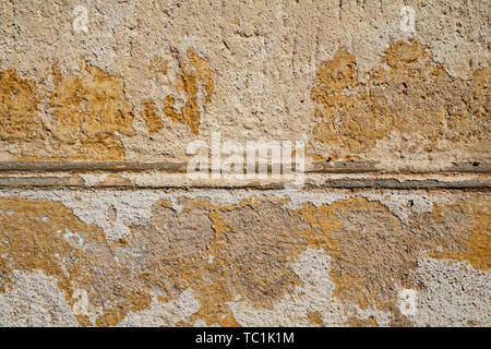 Yellow cracked weathered wall surface texture Stock Photo