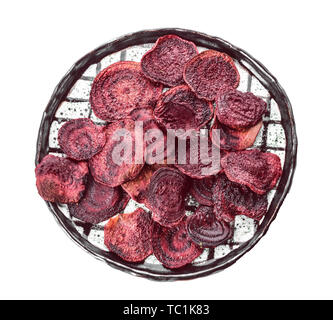 Plate with tasty beet chips on white background Stock Photo