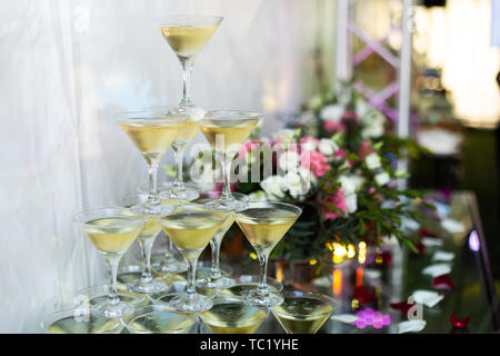 Champagne glasses standing in a tower at the party. Selective focus. Stock Photo